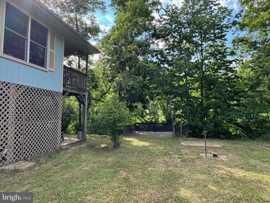 Beautiful, well-maintained cottage nestled along the banks of - photo 3