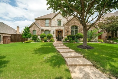 Tucked away on a beautifully landscaped cul-de-sac lot in the - photo 1