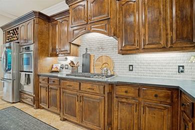 Tucked away on a beautifully landscaped cul-de-sac lot in the - photo 7