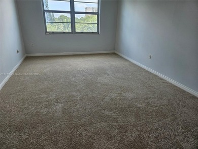 Discover this spacious corner two-bedroom, two-bath apartment