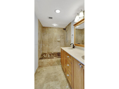 Discover this spacious corner two-bedroom, two-bath apartment