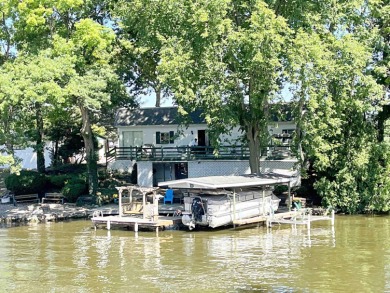 Get ready to start making lake memories here! Located on a quiet - Lake Home For Sale in Monticello, Indiana