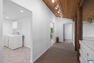 Panoramic golf-course views anchor this light-filled two-story - photo 11