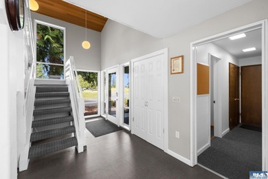 Panoramic golf-course views anchor this light-filled two-story - photo 13
