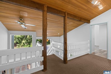 Panoramic golf-course views anchor this light-filled two-story - photo 14