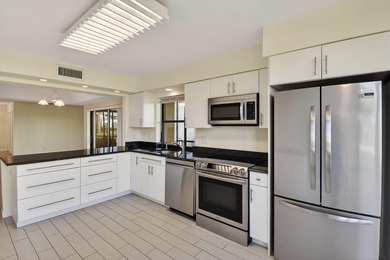 Beautifully maintained 1st floor condominium with extended water - photo 16