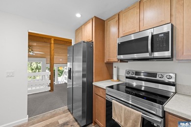 Panoramic golf-course views anchor this light-filled two-story - photo 17