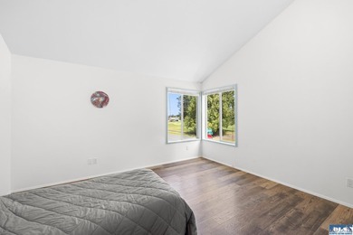 Panoramic golf-course views anchor this light-filled two-story - photo 23