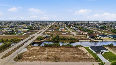 Clear lot on a freshwater canal in growing NW Cape Coral - photo 1
