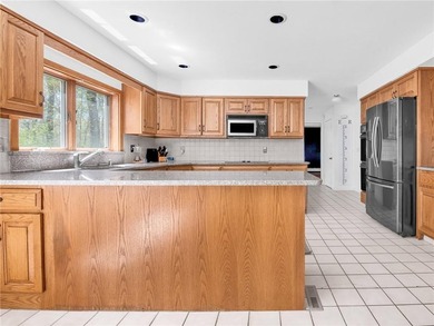 A circular driveway welcomes you to this elegant Colonial set on - photo 11