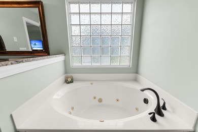 Nestled on a desirable corner lot, this beautiful two-story home - photo 23