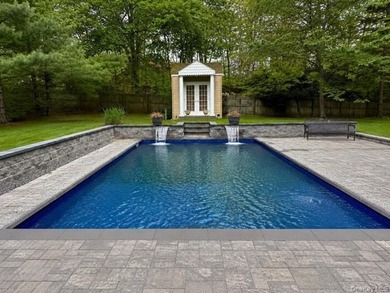 Tucked away behind a gated entrance and nestled among towering - photo 1