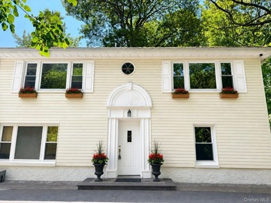 Tucked away behind a gated entrance and nestled among towering - photo 3