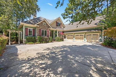 Tucked into a serene waterfront setting where towering trees - photo 4