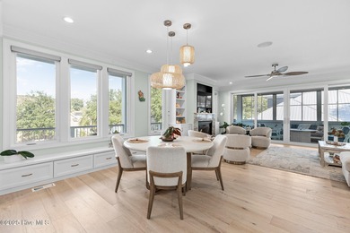 This gorgeous home in Kure Beach Village has 5 bedrooms, 5 1/2