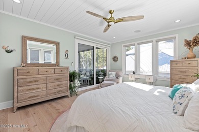 This gorgeous home in Kure Beach Village has 5 bedrooms, 5 1/2