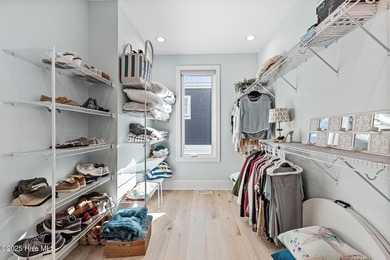 This gorgeous home in Kure Beach Village has 5 bedrooms, 5 1/2