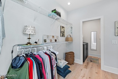 This gorgeous home in Kure Beach Village has 5 bedrooms, 5 1/2