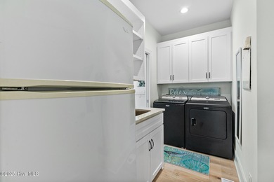 This gorgeous home in Kure Beach Village has 5 bedrooms, 5 1/2