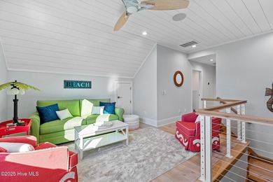 This gorgeous home in Kure Beach Village has 5 bedrooms, 5 1/2