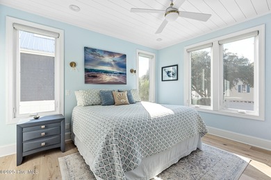 This gorgeous home in Kure Beach Village has 5 bedrooms, 5 1/2