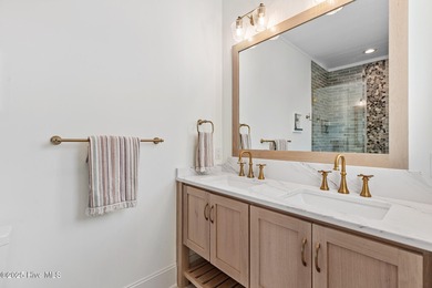 This gorgeous home in Kure Beach Village has 5 bedrooms, 5 1/2