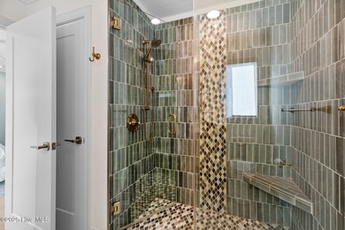 This gorgeous home in Kure Beach Village has 5 bedrooms, 5 1/2