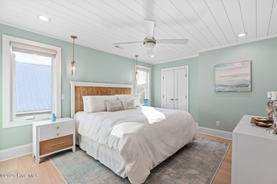 This gorgeous home in Kure Beach Village has 5 bedrooms, 5 1/2