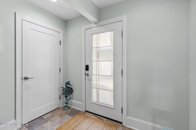 This gorgeous home in Kure Beach Village has 5 bedrooms, 5 1/2