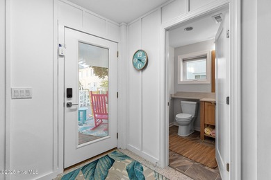 This gorgeous home in Kure Beach Village has 5 bedrooms, 5 1/2