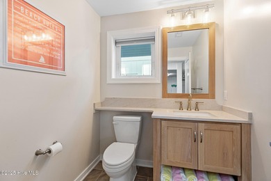 This gorgeous home in Kure Beach Village has 5 bedrooms, 5 1/2