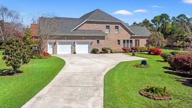 Nestled in a beautiful lakefront setting, this all-brick - photo 2