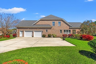 Nestled in a beautiful lakefront setting, this all-brick - photo 3