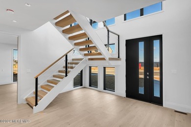 Experience unobstructed panoramic water views of the Manhattan - photo 3
