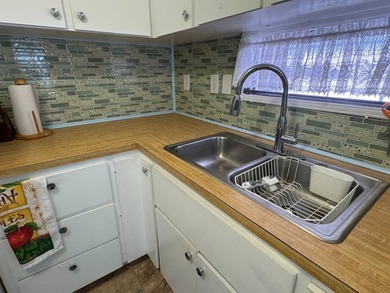 This 1971 home is offered turnkey and includes the golf cart! - photo 12