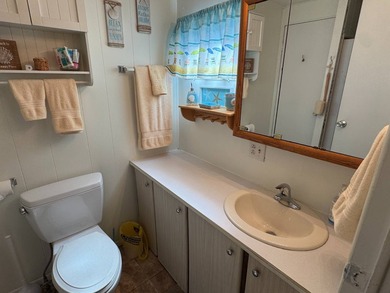 This 1971 home is offered turnkey and includes the golf cart! - photo 29