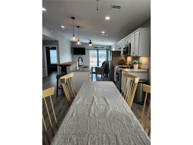This almost-new home comes fully furnished and ready to make - photo 4