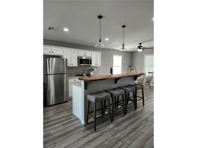 This almost-new home comes fully furnished and ready to make - photo 9