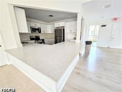This REMODELED ATTACHED VILLA is located in the very Lushly - photo 29