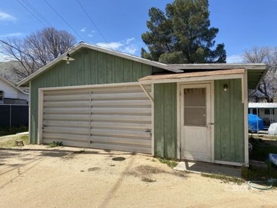 Wow, this 2-bedroom, 1.5 bath home has a HUGE 2 car garage with - photo 2