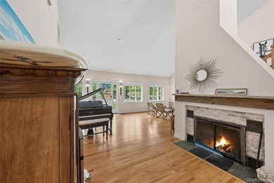 Set on a private 1.18-acre property in Hampton Bays, this - photo 11
