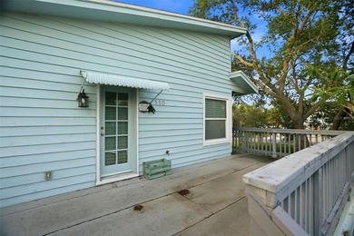ELEVATED KEY WEST STYLE HOME. GREAT ROOM FLOOR PLAN WITH ISLAND - photo 5