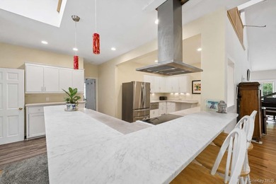 Set on a private 1.18-acre property in Hampton Bays, this - photo 15