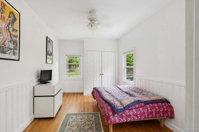 Set on a private 1.18-acre property in Hampton Bays, this - photo 20