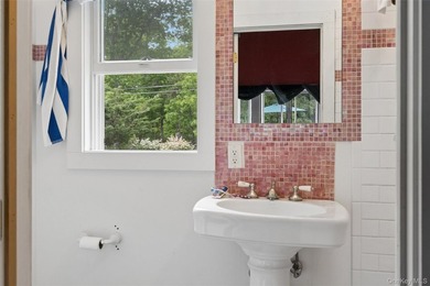 Set on a private 1.18-acre property in Hampton Bays, this - photo 24