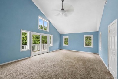 Set on a private 1.18-acre property in Hampton Bays, this - photo 29