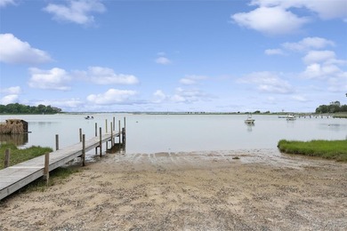 Set on a private 1.18-acre property in Hampton Bays, this - photo 32