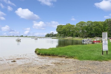 Set on a private 1.18-acre property in Hampton Bays, this - photo 34