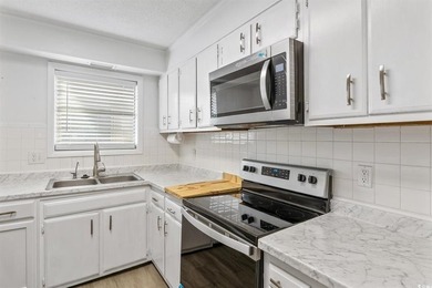 Completely renovated and ideally located, this stunning - photo 8