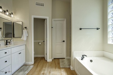 Gorgeous remodeled gated home in Las Sendas! Enter through the